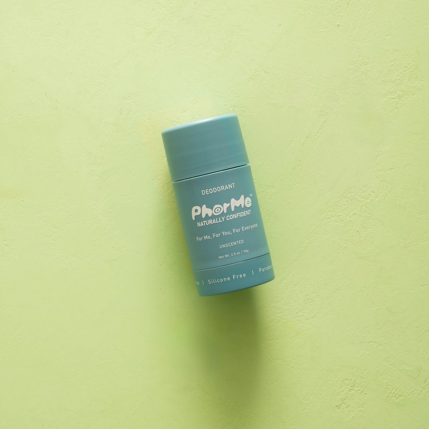 PhorMe unscented natural deodorant stick with teal packaging displayed on a light green background. Aluminum-free, silicone-free, paraben-free deodorant made for every body.